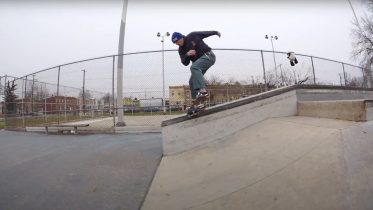 John Slaby doing a noseslide on a skateboard