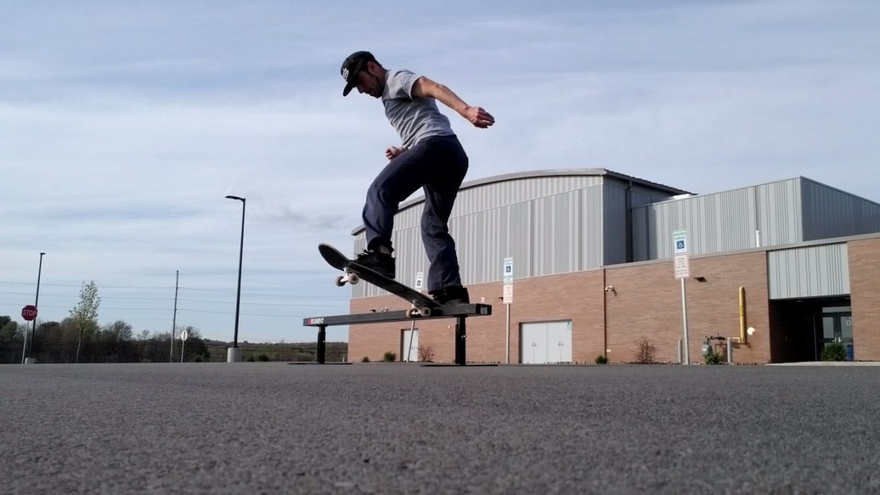 Steve Weber skateboarding doing a backside tailslide