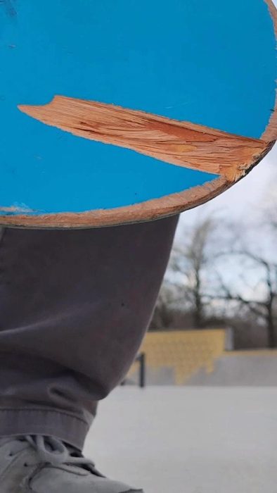 a large chip taken out of an enjoi impact light deck