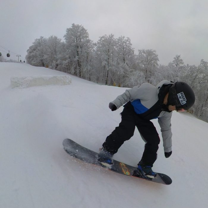 Landing a jump with the Lib Tech Off Ramp 2025 Snowboard