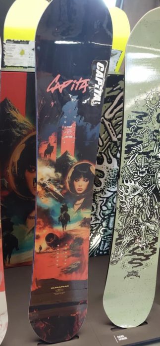 Capita Ultrafear (wide) next to the Capita Dark Horse snowboard