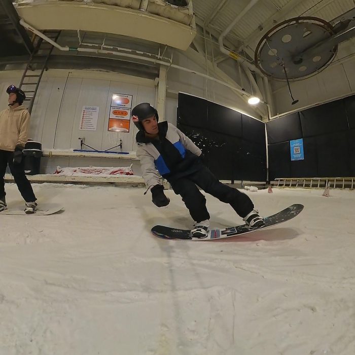 Never Summer Proto Type 3 Snowboard Review: Testing the Tech in the Park 29 Nose press with someone else in shot