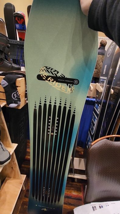 Ride Moderator Snowboard Review 2026: Too Much Board for the Park? 6 Looking at topsheet of the Ride Moderator at the 2026 preview EWSRA tradeshow