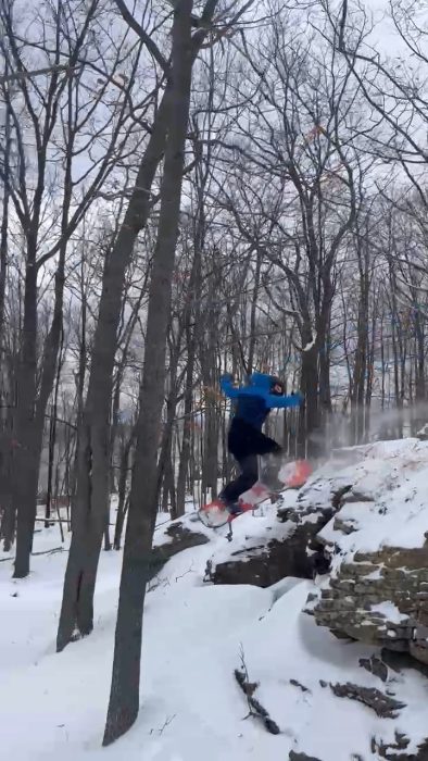 Backside 180 off a small cliff jump with Rome Ravine